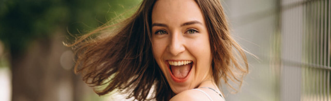 Picture of a woman smiling back at the canera